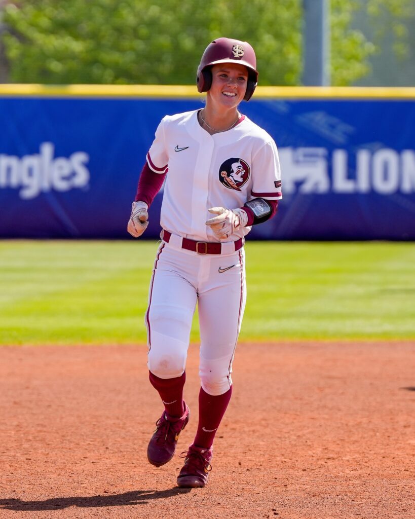sofrtball player smiling